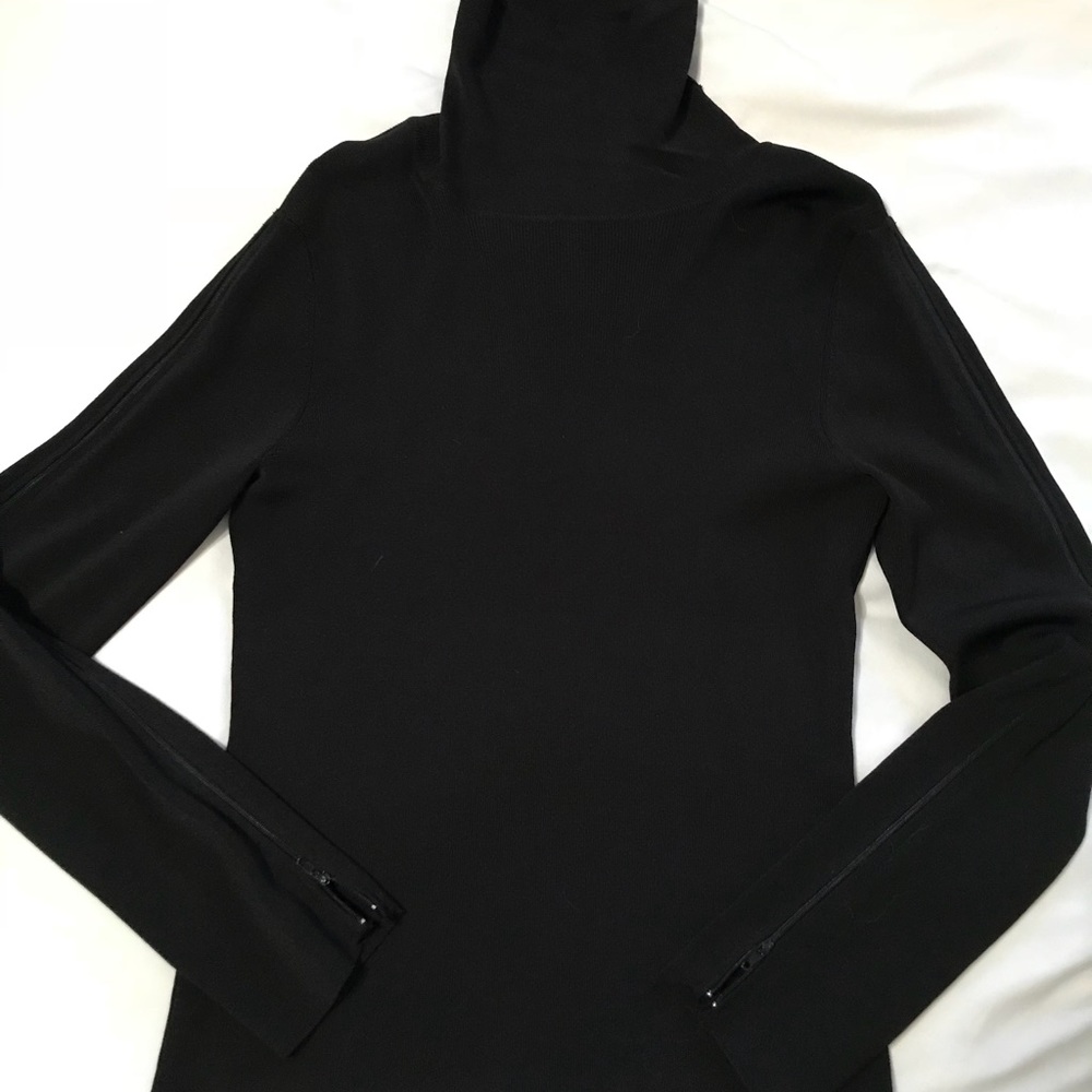black turtleneck with zippered sleeves